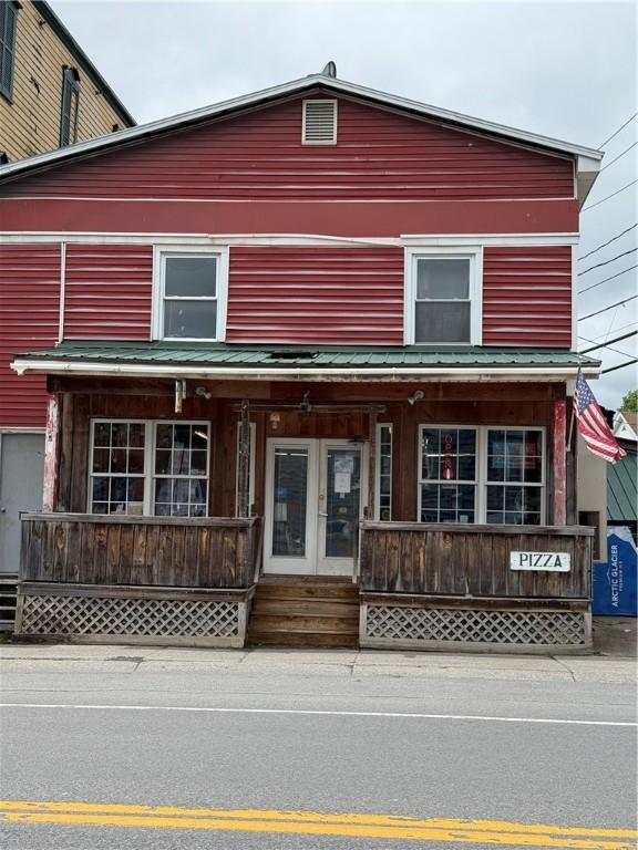 69 S Main St, Milford, NY 13807 - view of front of house featuring covered porch and french doors