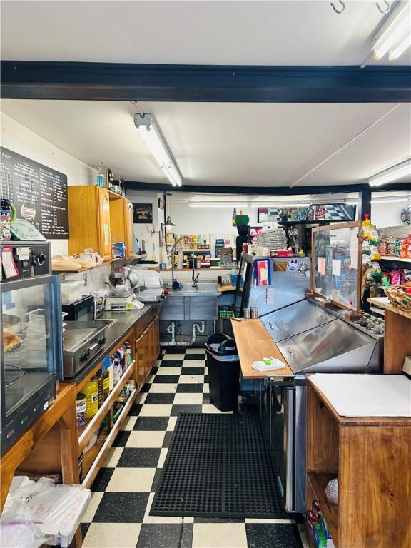69 S Main St, Milford, NY 13807 - misc room featuring tile patterned floors and a workshop area