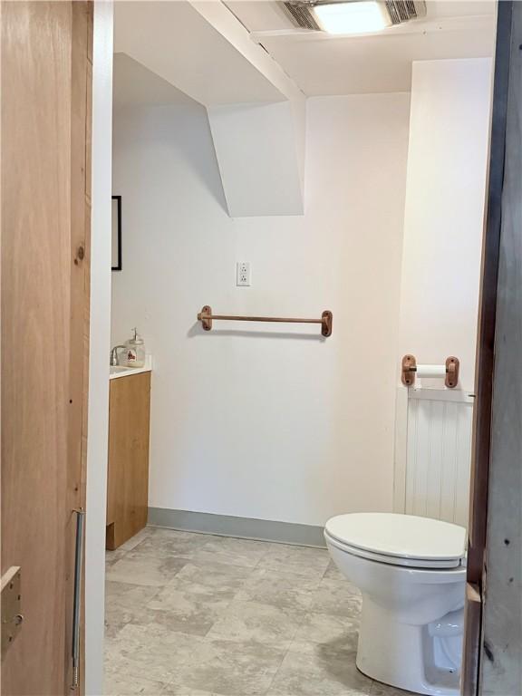 69 S Main St, Milford, NY 13807 - half bathroom with toilet and baseboards