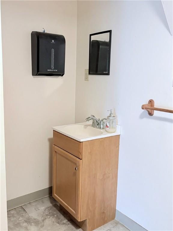 69 S Main St, Milford, NY 13807 - bathroom with baseboards and vanity