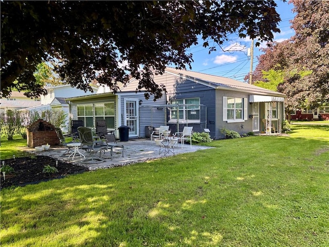 99 N Main St, Mount Morris, NY 14510 - back of property featuring a patio and a yard