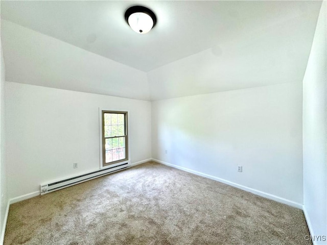 carpeted spare room featuring a baseboard radiator, lofted ceiling, and baseboards