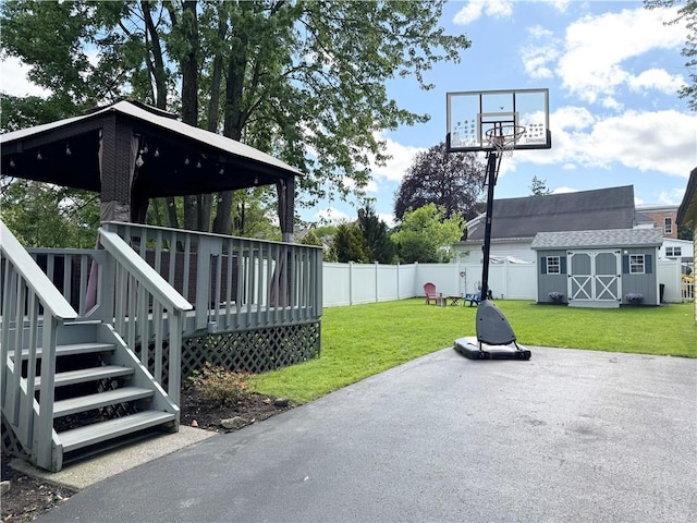 7 Macdougall St, Auburn, NY 13021 - view of patio featuring an outdoor structure, a deck, a gazebo, and a storage shed
