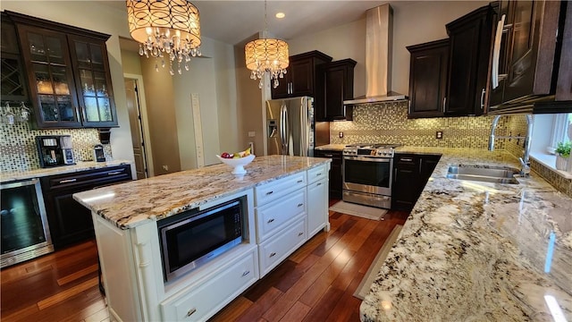 31 Putney Pl, Greece, NY 14468 - kitchen featuring stainless steel appliances, wall chimney range hood, beverage cooler, a sink, and a chandelier