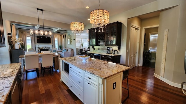 31 Putney Pl, Greece, NY 14468 - kitchen featuring glass insert cabinets, dark wood-style flooring, a fireplace, white cabinets, and recessed lighting