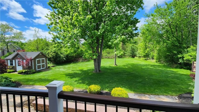 31 Putney Pl, Greece, NY 14468 - view of green lawn featuring a storage unit and an outdoor structure