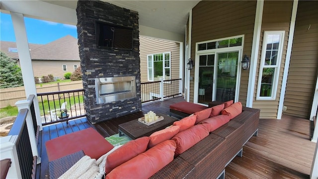 31 Putney Pl, Greece, NY 14468 - wooden deck with an outdoor living space with a fireplace and a porch