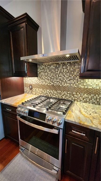 31 Putney Pl, Greece, NY 14468 - kitchen featuring gas range, wall chimney exhaust hood, dark wood-style flooring, and dark brown cabinetry