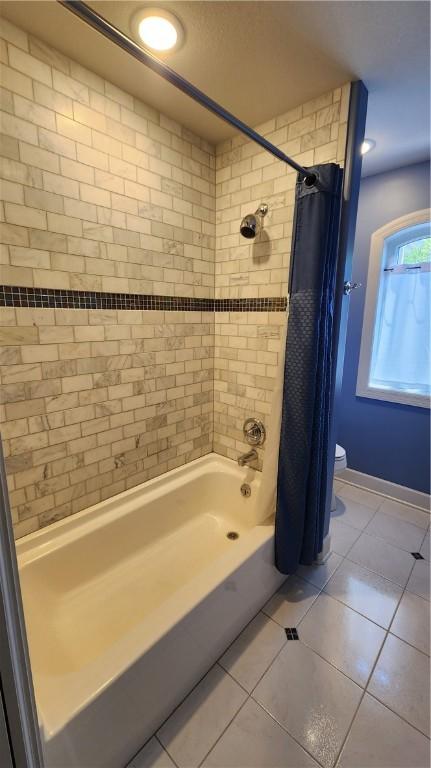 31 Putney Pl, Greece, NY 14468 - full bathroom featuring tile patterned flooring, shower / bath combination with curtain, toilet, and baseboards