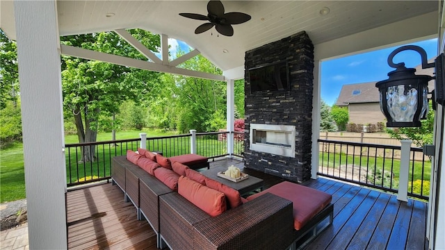 31 Putney Pl, Greece, NY 14468 - deck with a ceiling fan, an outdoor living space with a fireplace, and a yard