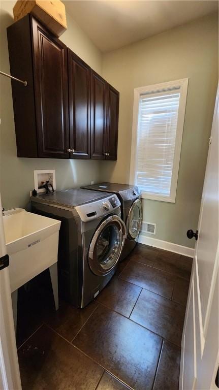 31 Putney Pl, Greece, NY 14468 - clothes washing area with separate washer and dryer, cabinet space, baseboards, and dark tile patterned flooring