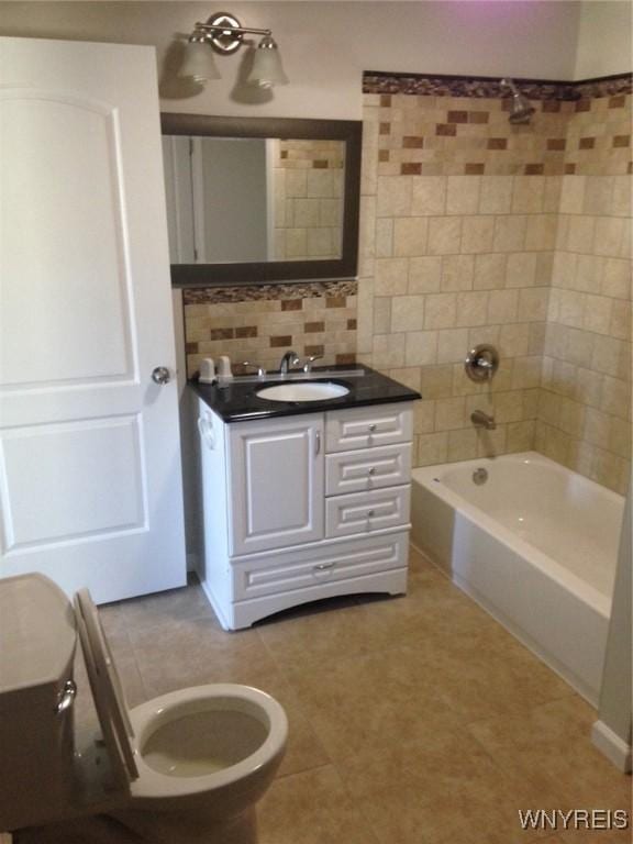 9 N Hartland St, Royalton, NY 14105 - full bath with toilet, vanity, decorative backsplash, and tub / shower combination