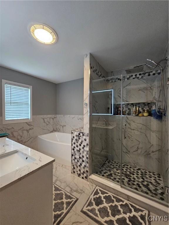 108 Sunflower Cir, Frankfort, NY 13340 - full bathroom featuring marble finish floors, a bath, a marble finish shower, vanity, and tile walls