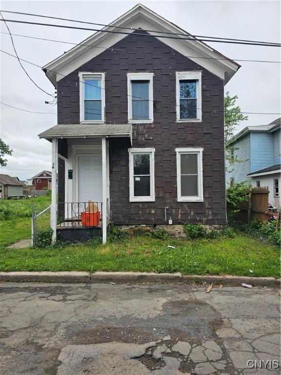 16 Barnes Ave, Utica, NY 13502 - traditional-style home featuring fence and stone siding