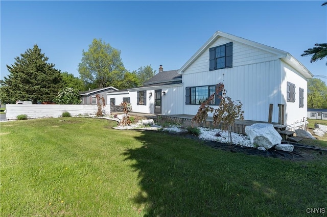 20304 Burton Rd, Hounsfield, NY 13685 - rear view of house with a lawn and a chimney