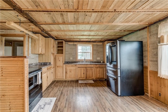 20304 Burton Rd, Hounsfield, NY 13685 - kitchen with stainless steel appliances, light brown cabinets, a sink, light wood-style flooring, and dark countertops