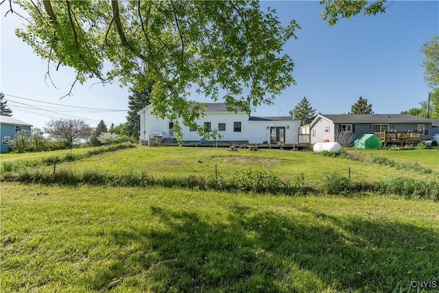 20304 Burton Rd, Hounsfield, NY 13685 - view of green lawn with a deck