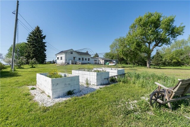 20304 Burton Rd, Hounsfield, NY 13685 - view of grassy yard with a vegetable garden