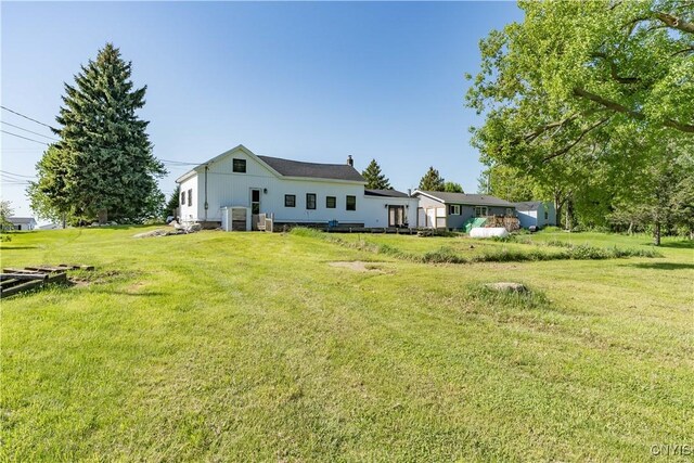 20304 Burton Rd, Hounsfield, NY 13685 - back of property with a yard