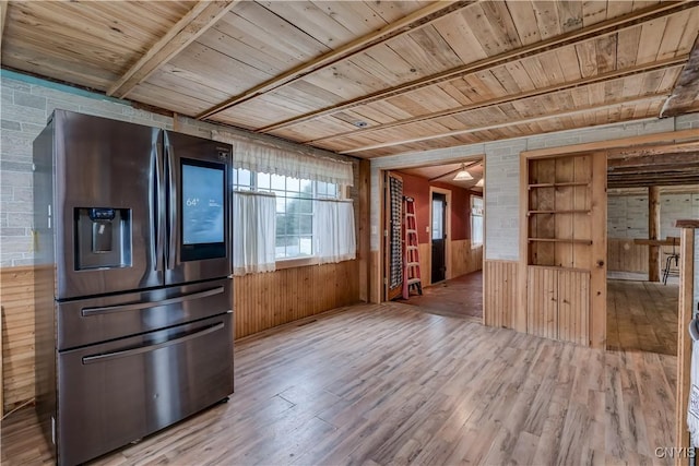 20304 Burton Rd, Hounsfield, NY 13685 - kitchen featuring stainless steel fridge, wooden ceiling with exposed beams, wood finished floors, and wooden walls