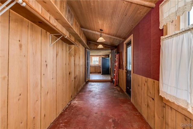 20304 Burton Rd, Hounsfield, NY 13685 - hallway with wooden walls, finished concrete floors, and wood ceiling