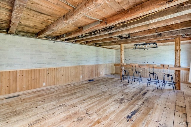 20304 Burton Rd, Hounsfield, NY 13685 - interior space featuring hardwood / wood-style floors, wooden walls, and a bar