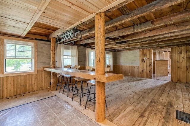 20304 Burton Rd, Hounsfield, NY 13685 - dining room featuring wood walls and wooden ceiling