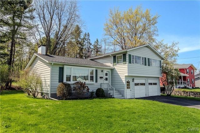 18 Court Knolle, New Hartford, NY 13413 - tri-level home featuring an attached garage, driveway, a chimney, and a front yard