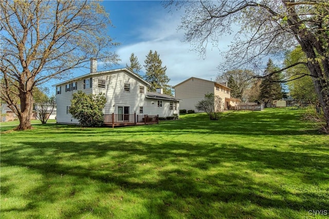 18 Court Knolle, New Hartford, NY 13413 - view of property exterior with a deck, a chimney, and a yard
