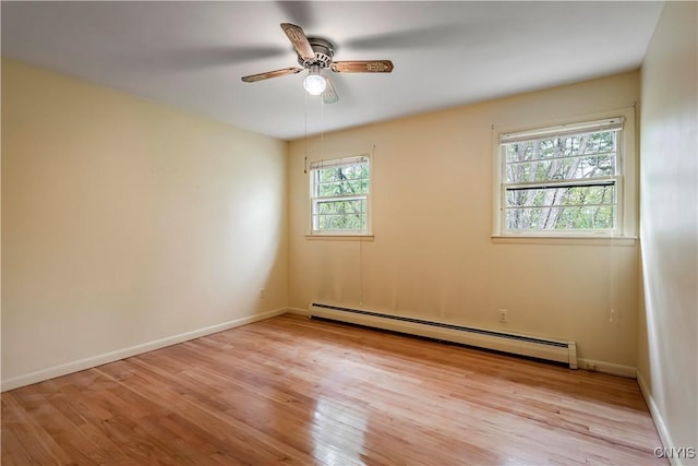 18 Court Knolle, New Hartford, NY 13413 - spare room featuring baseboard heating, light wood-type flooring, ceiling fan, and baseboards