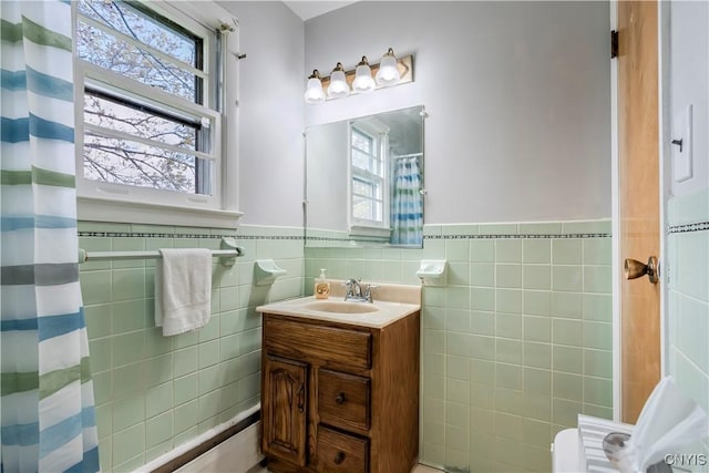 18 Court Knolle, New Hartford, NY 13413 - bathroom featuring a wainscoted wall, tile walls, and vanity