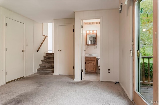 18 Court Knolle, New Hartford, NY 13413 - entryway featuring light colored carpet, stairway, healthy amount of natural light, and baseboards