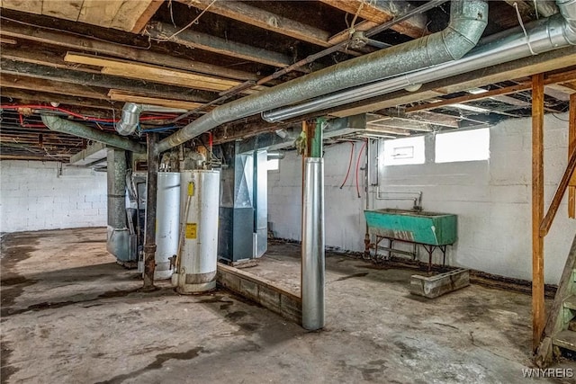basement with gas water heater, a sink, and heating unit
