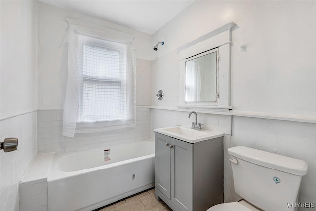 full bath with toilet, vanity, and tile patterned floors