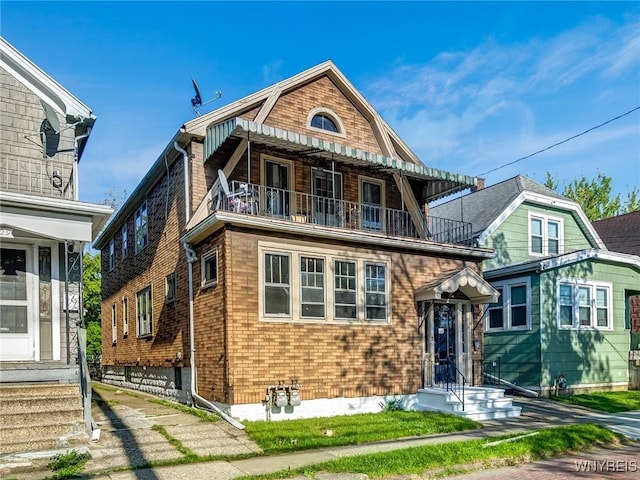 27 E End Ave, Cheektowaga, NY 14225 - shingle-style home featuring a balcony and brick siding