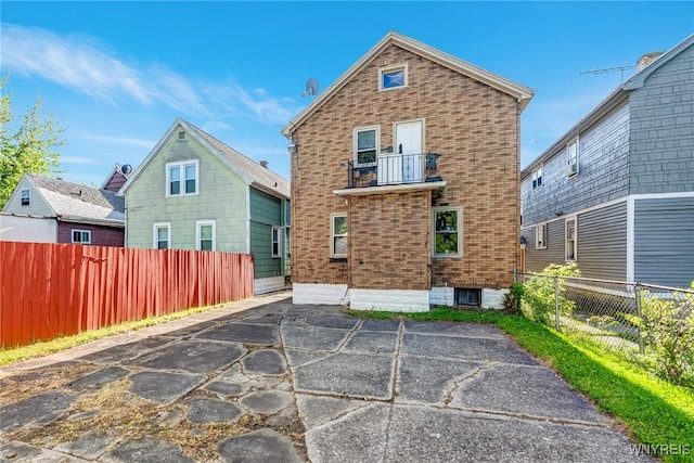 27 E End Ave, Cheektowaga, NY 14225 - back of house featuring a patio, brick siding, and a balcony