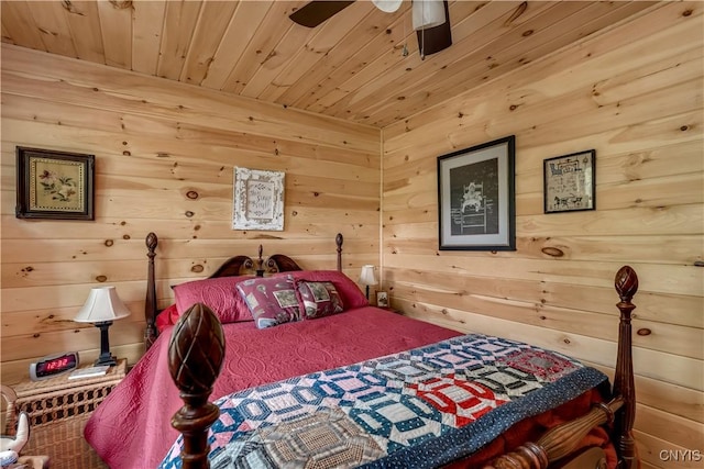 bedroom with wooden ceiling and wooden walls