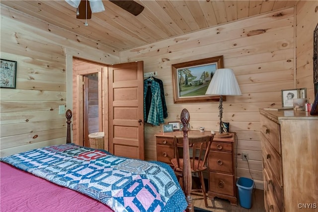 bedroom featuring wooden ceiling and wooden walls