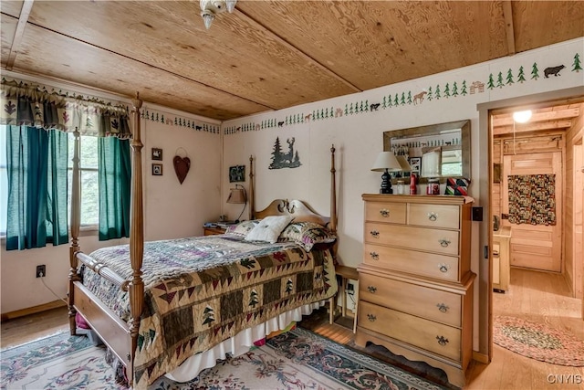 bedroom featuring wood ceiling and wood finished floors