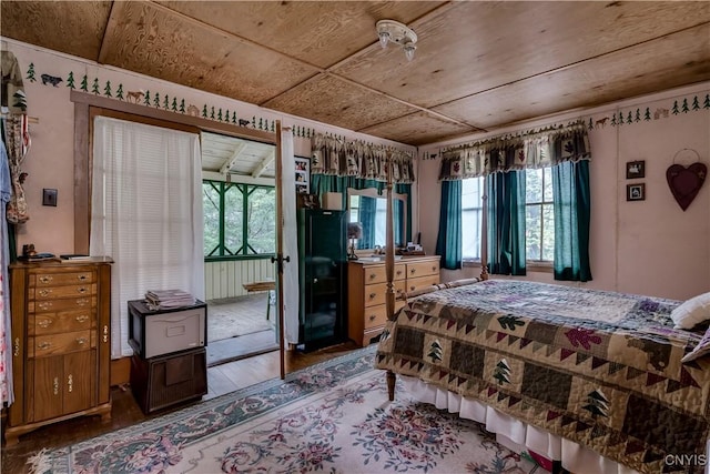 bedroom with hardwood / wood-style flooring and access to outside