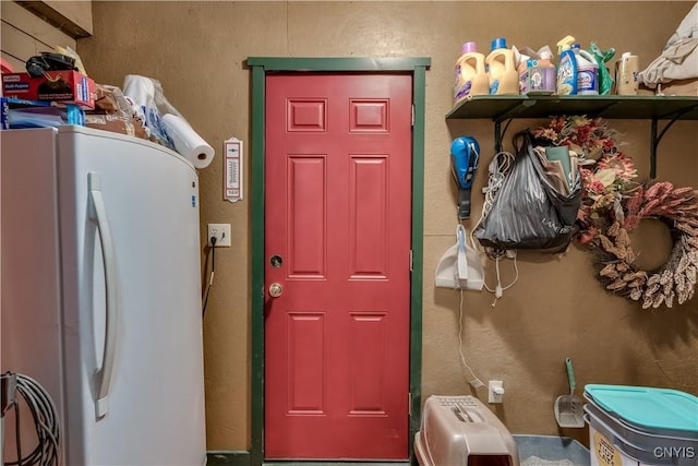 laundry room featuring a textured wall