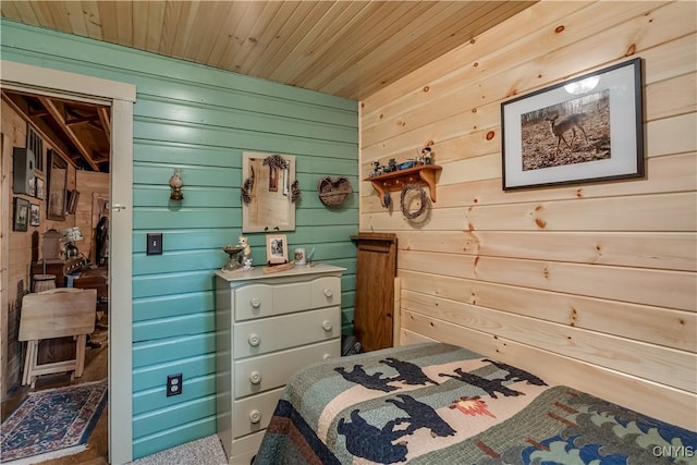 bedroom featuring wood walls and wooden ceiling