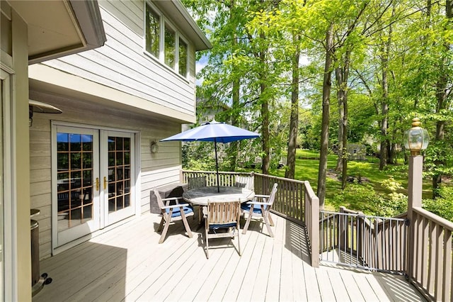 7 Mount View Cres, Penfield, NY 14580 - deck with outdoor dining space, french doors, and view of wooded area