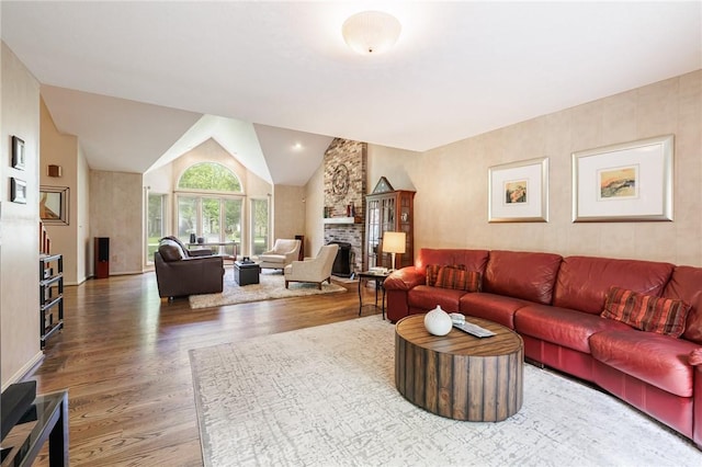 7 Mount View Cres, Penfield, NY 14580 - living room with wood finished floors, a large fireplace, and lofted ceiling