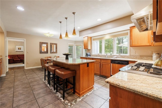 7 Mount View Cres, Penfield, NY 14580 - kitchen with a kitchen bar, light stone counters, a kitchen island, dishwashing machine, and recessed lighting