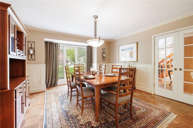 7 Mount View Cres, Penfield, NY 14580 - dining area with french doors, a wainscoted wall, crown molding, and a decorative wall