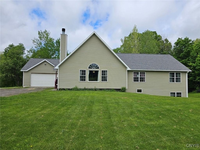 437 Nye Rd, Virgil, NY 13045 - view of front of house with a front yard, a chimney, driveway, an outbuilding, and an attached garage