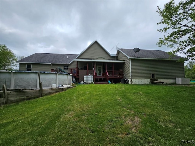 437 Nye Rd, Virgil, NY 13045 - back of house with a lawn and covered porch
