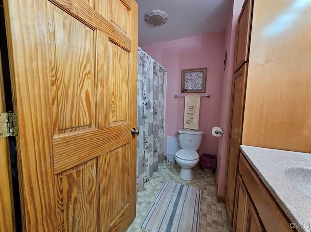 437 Nye Rd, Virgil, NY 13045 - bathroom with toilet, vanity, curtained shower, and tile patterned floors