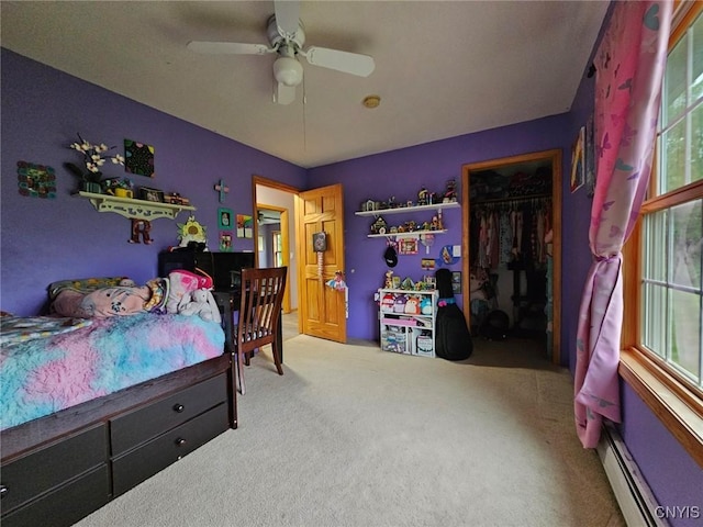 437 Nye Rd, Virgil, NY 13045 - bedroom with baseboard heating, carpet flooring, multiple windows, and a closet